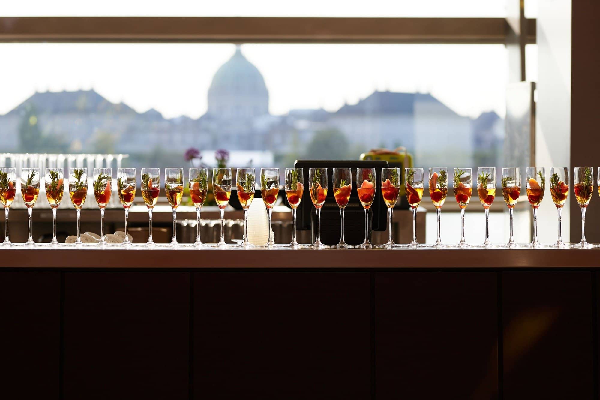 Cocktail reception setup overlooking the city during an international corporate meeting